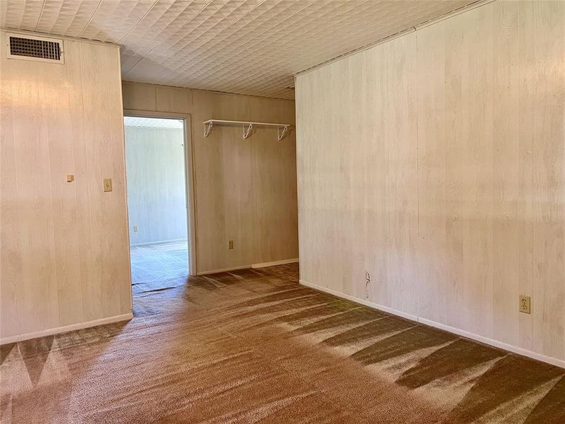 Carpeted Livingroom with wooden walls Carpeted Livingroom with wooden walls