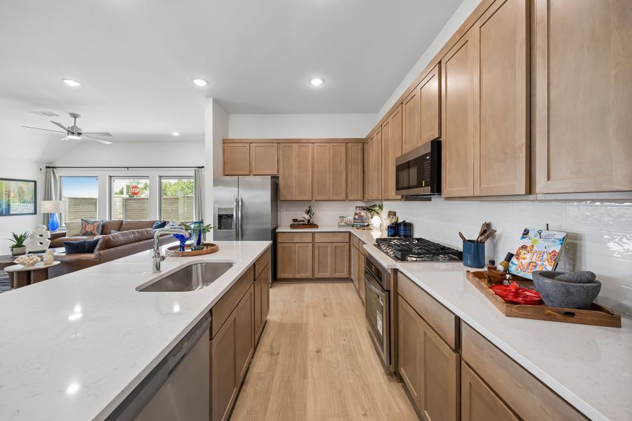 Kitchen in the Pecos home plan by Trophy Signature Homes – REPRESENTATIVE PHOTO