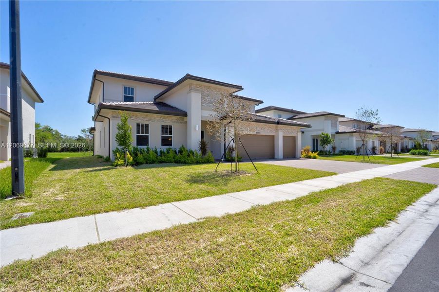 Front exterior of a new home in , Davie, FL, highlighting curb appeal (Image 25). Front exterior of a new home in , Davie, FL, highlighting curb appeal (Image 25).