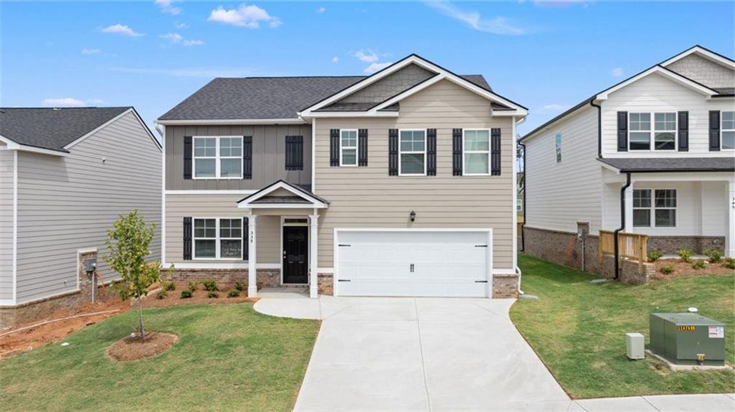 Front exterior of a new home in The Preserve at Agricultural Village, Perry, GA, highlighting curb appeal (Image 1). Front exterior of a new home in The Preserve at Agricultural Village, Perry, GA, highlighting curb appeal (Image 1).