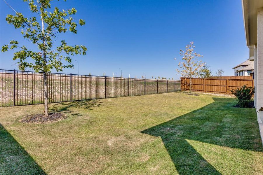 View of exterior entry featuring roof with shingles and brick siding View of exterior entry featuring roof with shingles and brick siding