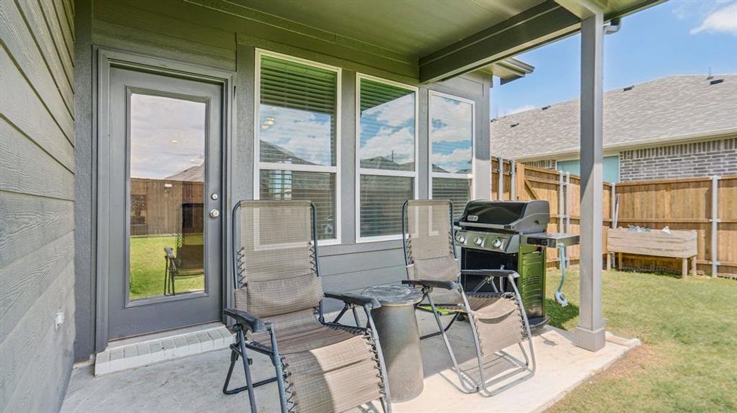 Exterior details and patio area of a home in Venetian, Weston (Image 24).