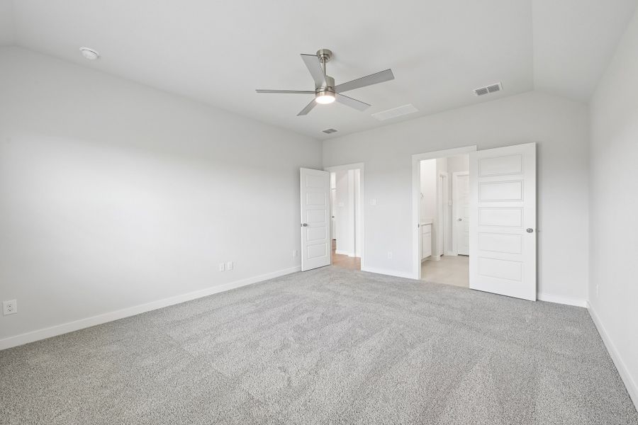 Primary Bedroom in the Heisman home plan by Trophy Signature Homes Primary Bedroom in the Heisman home plan by Trophy Signature Homes