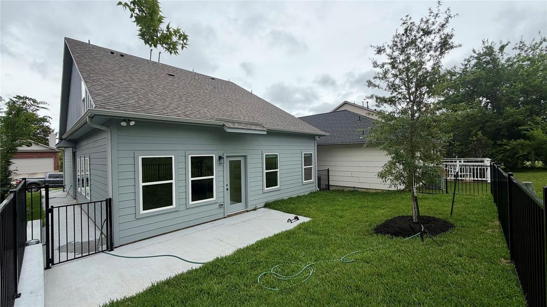 Back yard is fenced and backs up to green space