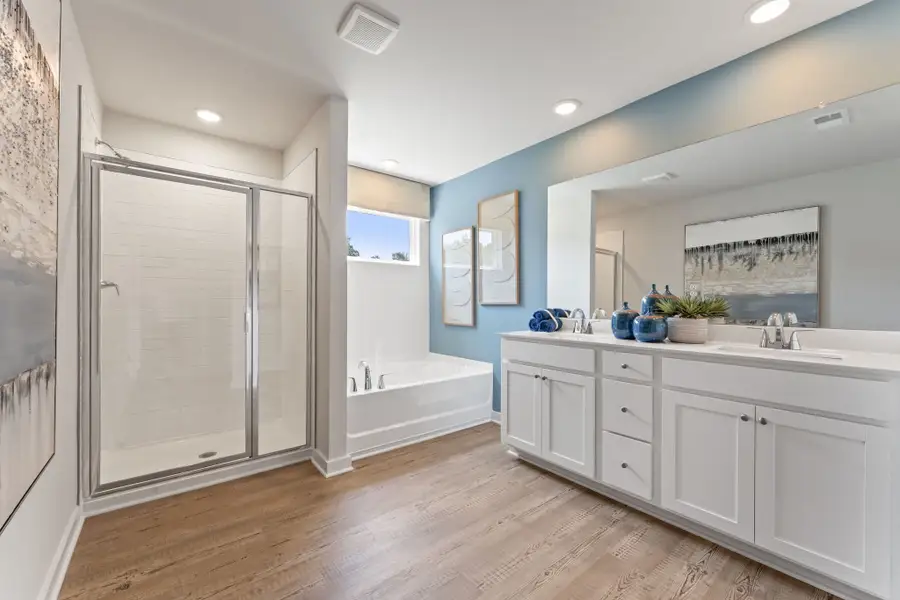 A bathroom with a tub and sink.