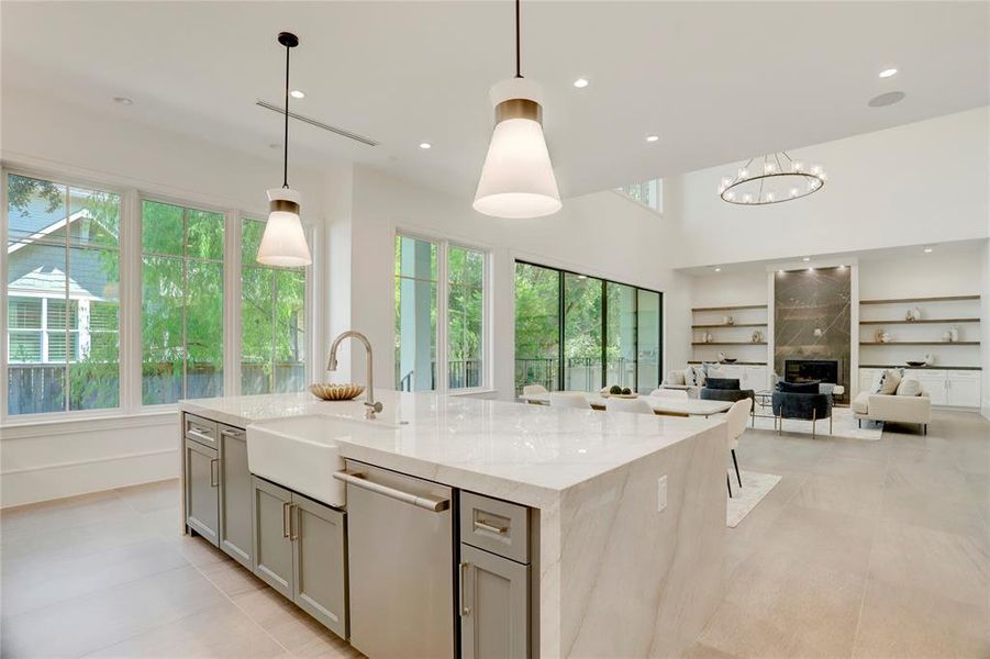 Large windows line the walls from the Kitchen to the Family Room, providing wonderful natural light and views of the backyard.