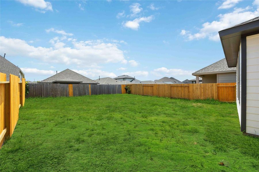 Exterior details and patio area of a home in Bluebonnet Village, Bellville (Image 3).