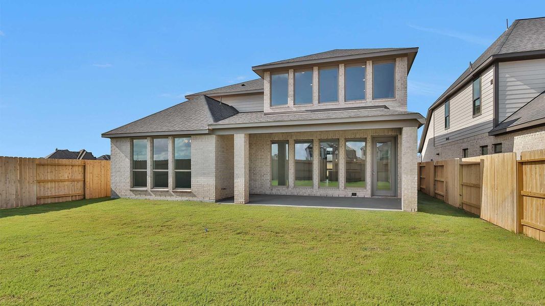 Front exterior of a new home in Grange 50', Katy, TX, highlighting curb appeal (Image 1). Front exterior of a new home in Grange 50', Katy, TX, highlighting curb appeal (Image 1).