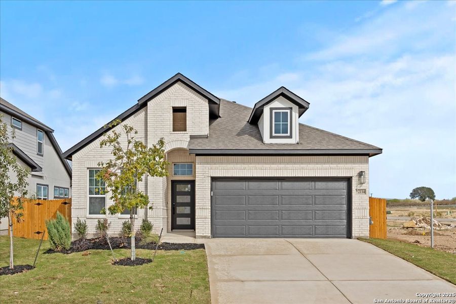 Front exterior of a new home in Stream Waters, Seguin, TX, highlighting curb appeal (Image 1). Front exterior of a new home in Stream Waters, Seguin, TX, highlighting curb appeal (Image 1).