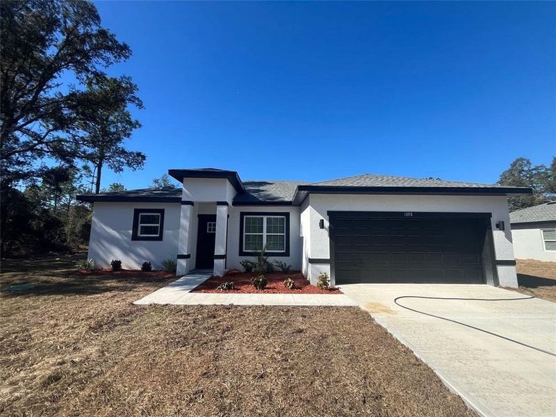 Front exterior of a new home in , Dunnellon, FL, highlighting curb appeal (Image 1). Front exterior of a new home in , Dunnellon, FL, highlighting curb appeal (Image 1).