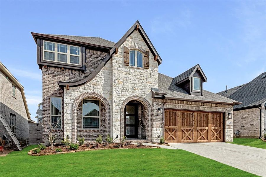 Front exterior of a new home in Painted Tree, McKinney, TX, highlighting curb appeal (Image 2).