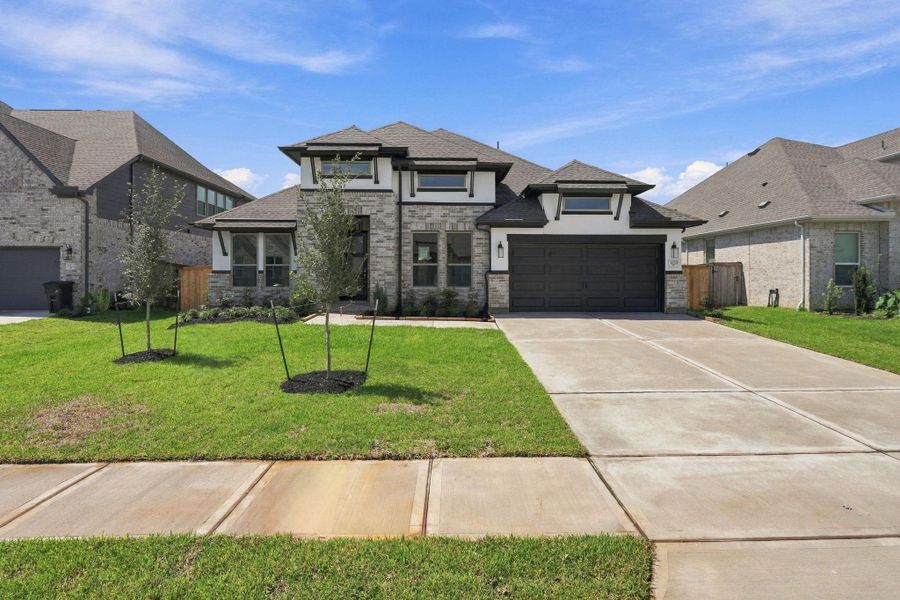 Front exterior of a new home in Coastal Point, League City, TX, highlighting curb appeal (Image 24).