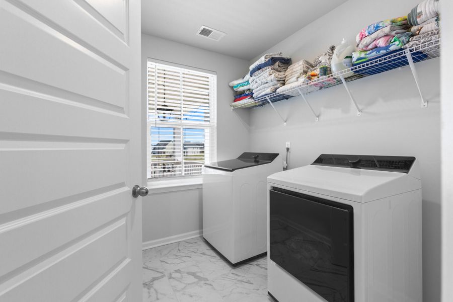 Furnished interior view inside a new home in Sweetgrass at Summers Corner, Summerville (Image 36).