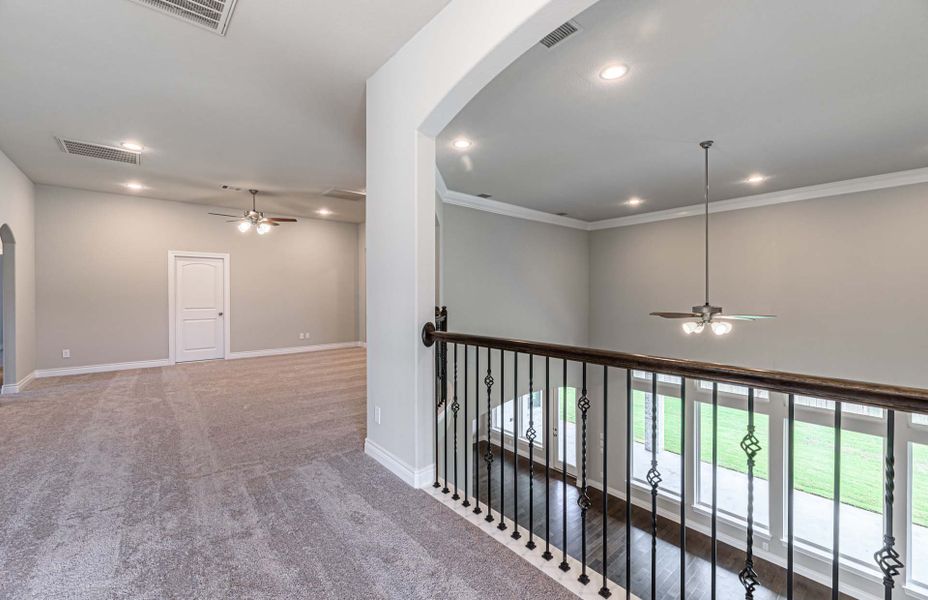 Representative unfurnished interior of a home built from the 4195 by Ravenna Homes in Artavia 70′, Conroe (Image 59). Representative unfurnished interior of a home built from the 4195 by Ravenna Homes in Artavia 70′, Conroe (Image 59).