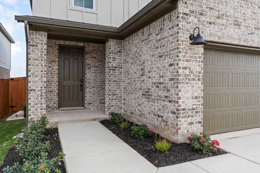 Exterior details and patio area of a home in Terrace Collection at Lariat, Liberty Hill (Image 27).