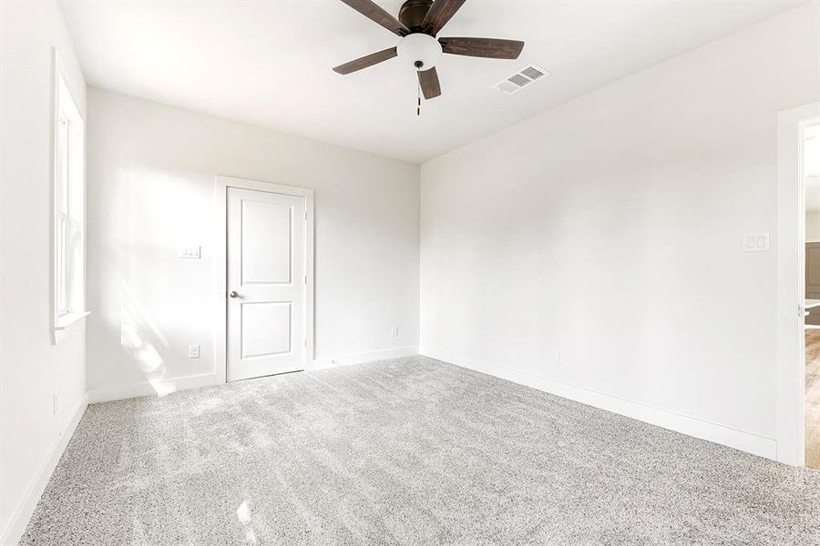 Another view of the primary bedroom.  Open off the dining room.