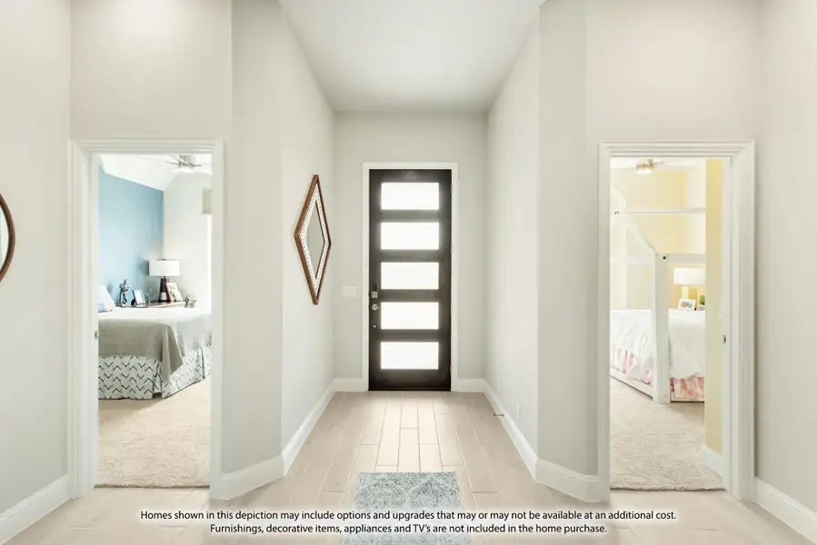 Entryway hallway with dark glass-panel front door, light wood floors, and open doorways to two bedrooms on each side. Entryway hallway with dark glass-panel front door, light wood floors, and open doorways to two bedrooms on each side.