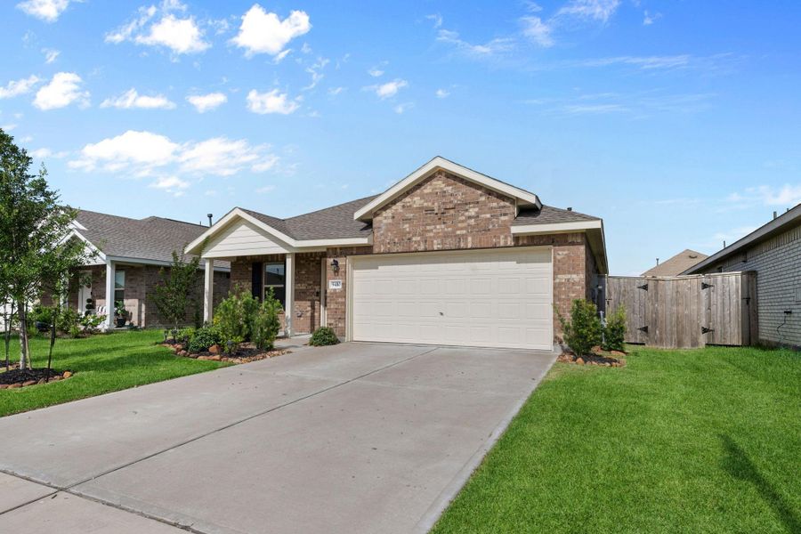 Front exterior of a new home in Sterling Point at Baytown Crossings: Watermill Collection, Baytown, TX, highlighting curb appeal (Image 2). Front exterior of a new home in Sterling Point at Baytown Crossings: Watermill Collection, Baytown, TX, highlighting curb appeal (Image 2).