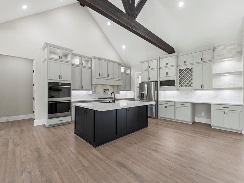 Kitchen with ample cabinet space and interior lighting. That overlooks the living area. Kitchen with ample cabinet space and interior lighting. That overlooks the living area.