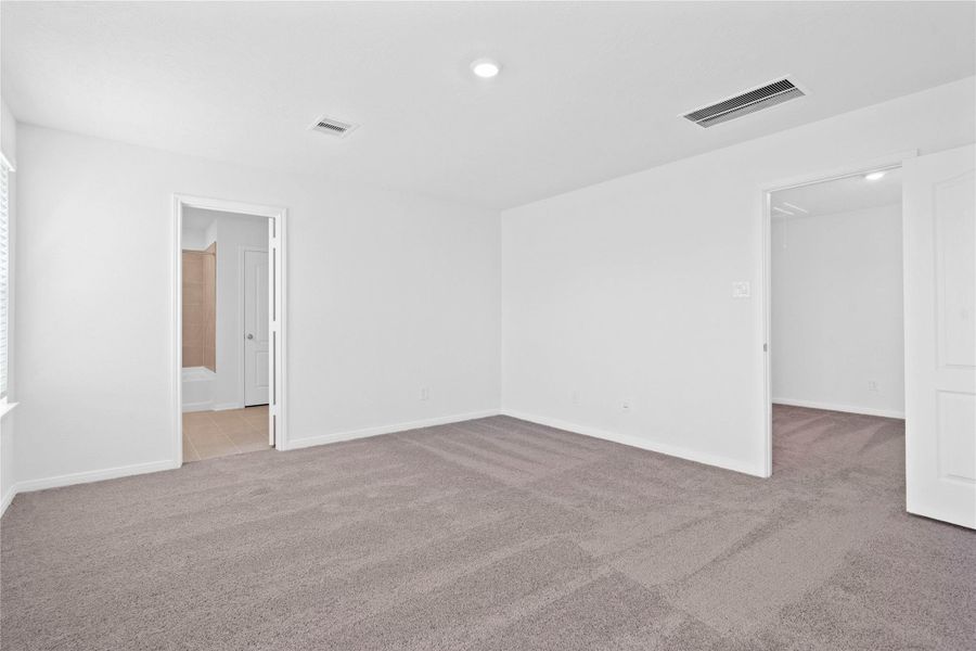 Additional view from the primary bedroom looking towards the primary bathroom and the door to the Loft! Additional view from the primary bedroom looking towards the primary bathroom and the door to the Loft!