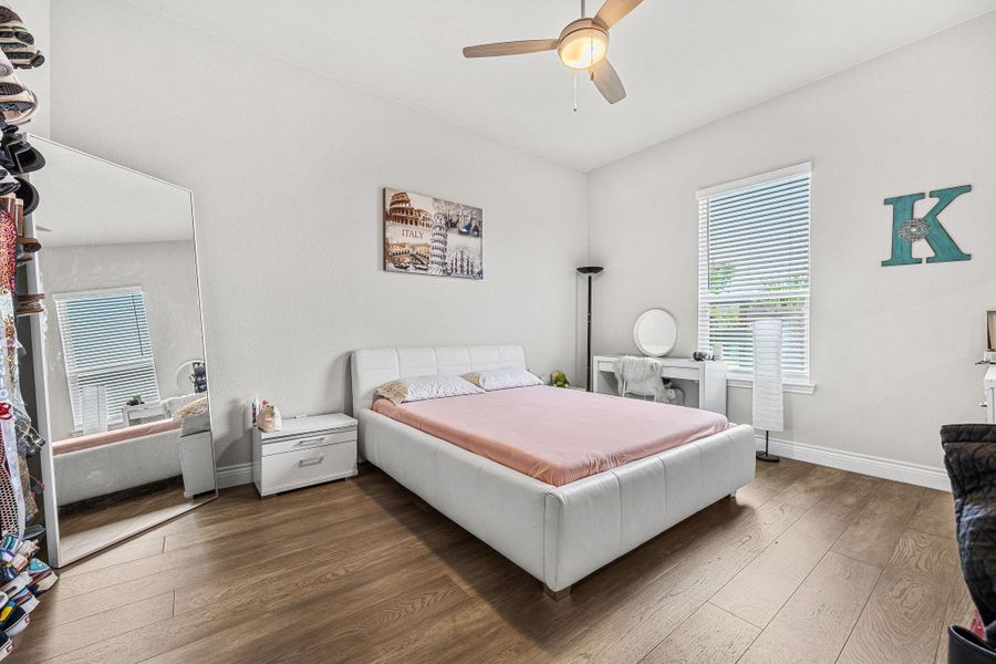 Hardwood floors and a window with natural illumination enhance this private sleeping area. Hardwood floors and a window with natural illumination enhance this private sleeping area.