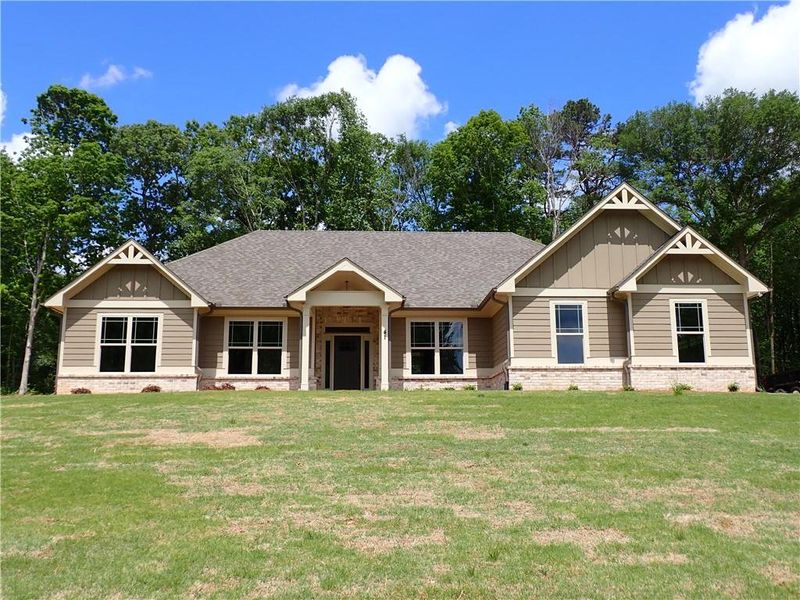 Front exterior of a new home in , Jefferson, GA, highlighting curb appeal (Image 1).