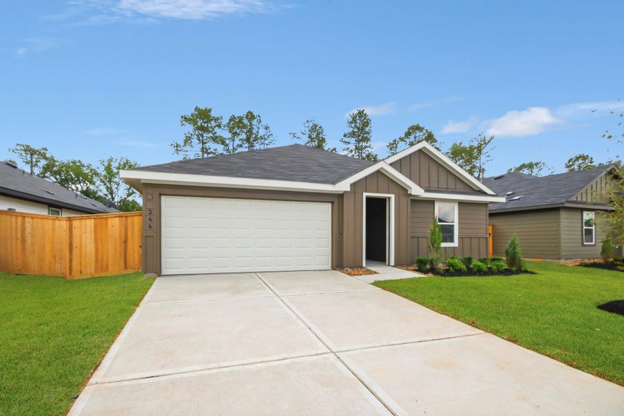 Front exterior of a new home in New Waverly Station, New Waverly, TX, highlighting curb appeal (Image 2). Front exterior of a new home in New Waverly Station, New Waverly, TX, highlighting curb appeal (Image 2).