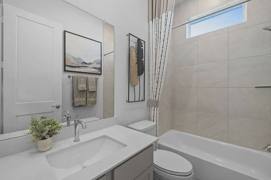 Representative furnished interior of a home built from the Bonneville by Chesmar Homes in Grange, Katy (Image 19).