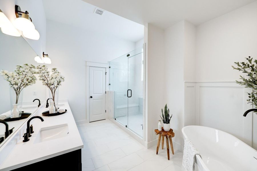 Ensuite Oasis: Featuring dual vanities, a spacious glass-enclosed shower, and a luxurious soaking tub for the ultimate relaxation. Ensuite Oasis: Featuring dual vanities, a spacious glass-enclosed shower, and a luxurious soaking tub for the ultimate relaxation.