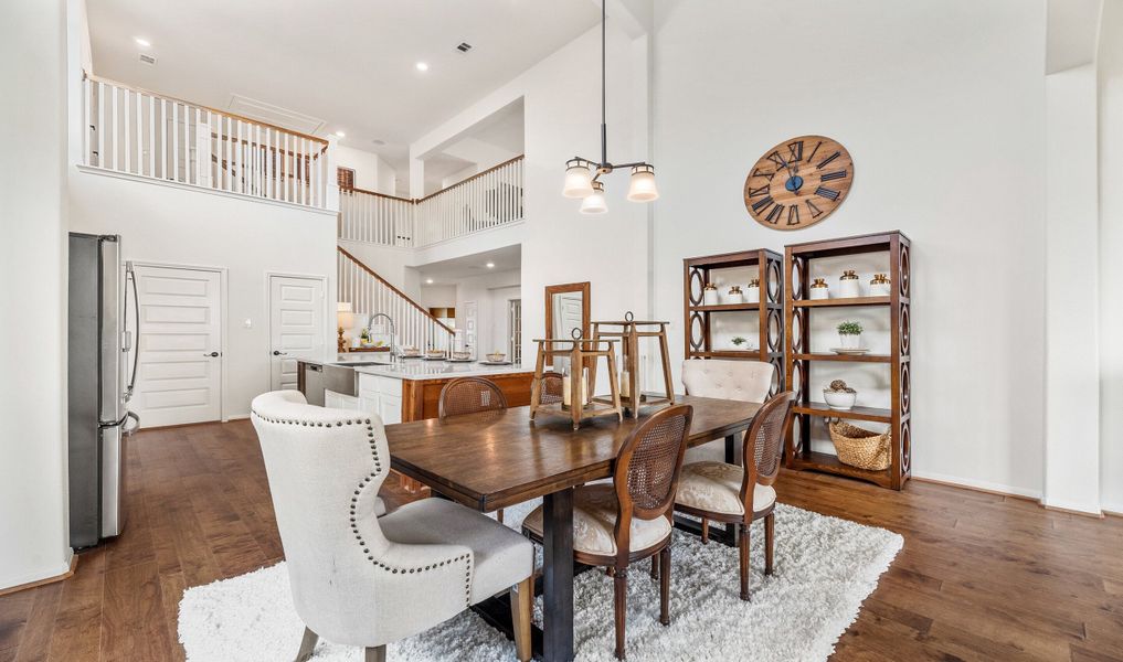 Dining area with archway leading to great room