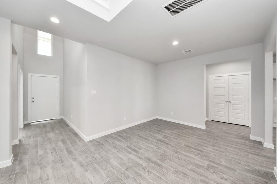 This spacious dining room features elegant flooring, custom paint, and adjacent to family room and kitchen for open concept feel. Sample photo of completed home with similar plan. Actual colors and selections may vary. Call for more info.