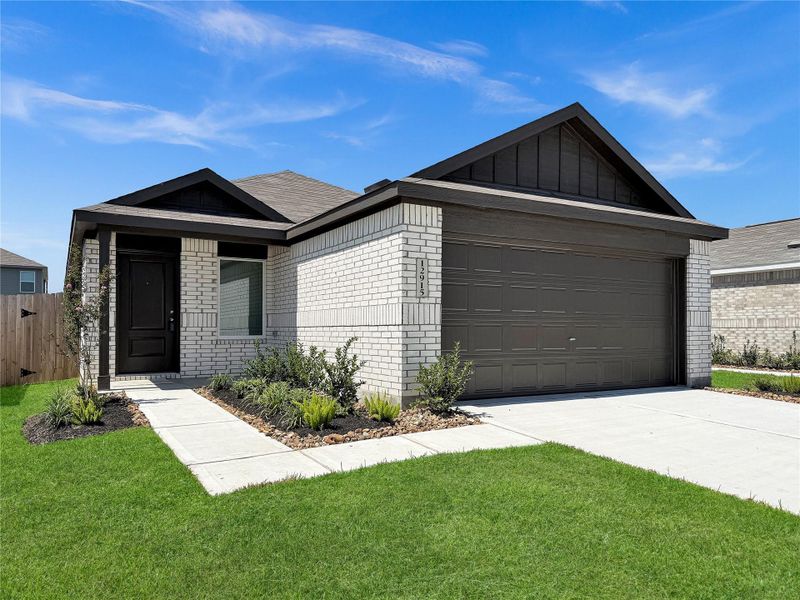 Front exterior of a new home in Sweetgrass Village: Cottage Collection, Crosby, TX, highlighting curb appeal (Image 1).