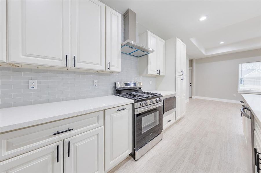 Brand-new kitchen featuring sleek countertops, modern cabinetry, and stainless steel appliances—perfect for cooking and entertaining!