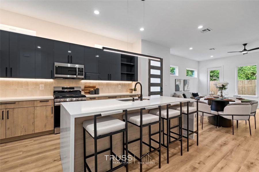 Purposefully designed for flow, this kitchen opens effortlessly to the dining area, ideal for both quiet mornings and lively dinner gatherings.