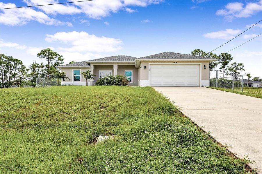 Front exterior of a new home in , Cape Coral, FL, highlighting curb appeal (Image 23).