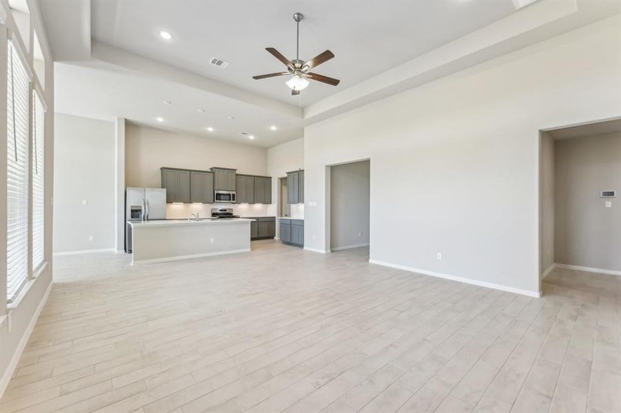 The neutral color palette and elegant tile flooring provide a blank canvas for your style.