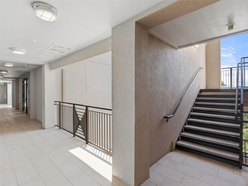 Tiled Corridors and decorative railings adorn the stone and stucco building. Tiled Corridors and decorative railings adorn the stone and stucco building.