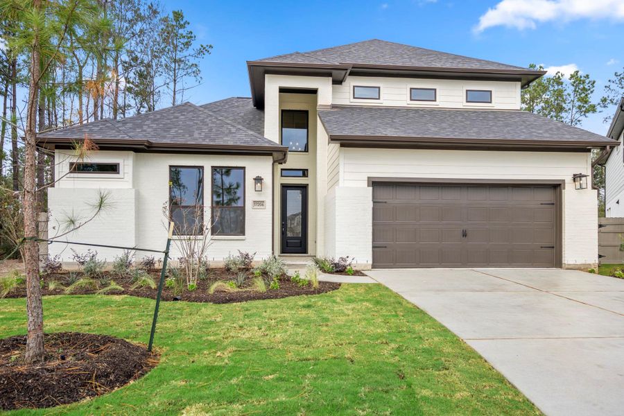 Front exterior of a new home in ARTAVIA 55' Lots, Conroe, TX, highlighting curb appeal (Image 26). Front exterior of a new home in ARTAVIA 55' Lots, Conroe, TX, highlighting curb appeal (Image 26).