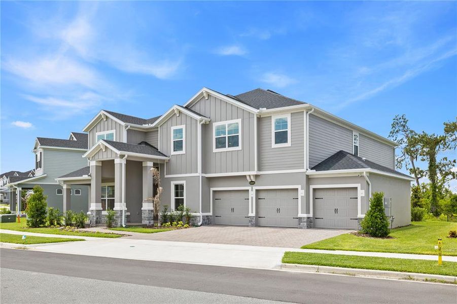 Front exterior of a new home in , Winter Garden, FL, highlighting curb appeal (Image 31).