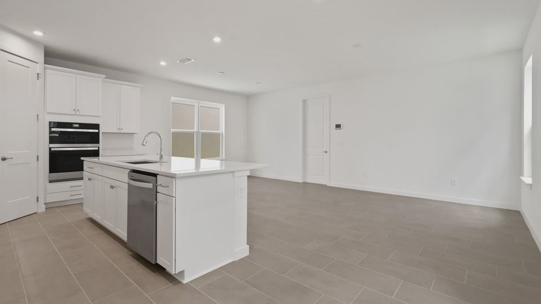 Spacious kitchen, living, and dining areas flow together seamlessly—ideal for everyday living and effortless entertaining. Spacious kitchen, living, and dining areas flow together seamlessly—ideal for everyday living and effortless entertaining.