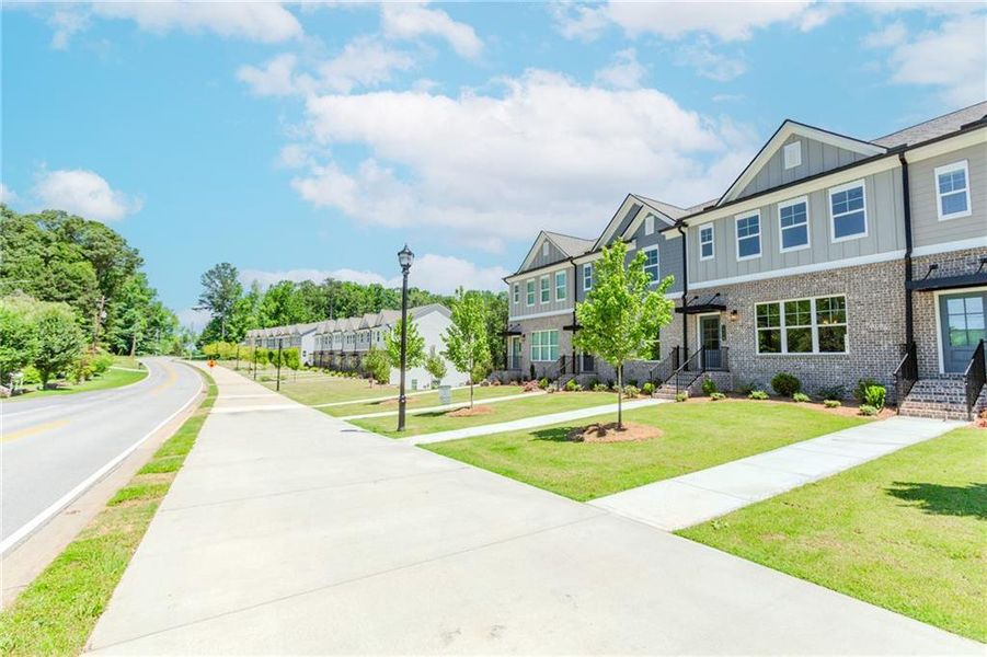 Front exterior of a new home in Hillcrest Landing, Sugar Hill, GA, highlighting curb appeal (Image 25). Front exterior of a new home in Hillcrest Landing, Sugar Hill, GA, highlighting curb appeal (Image 25).