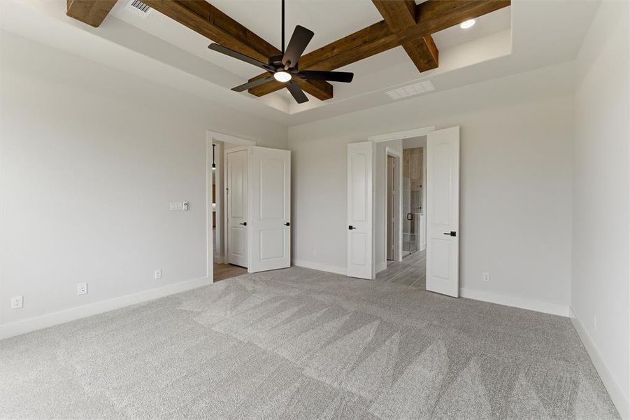 Unfurnished bedroom with coffered ceiling, ceiling fan, light colored carpet, and recessed lighting