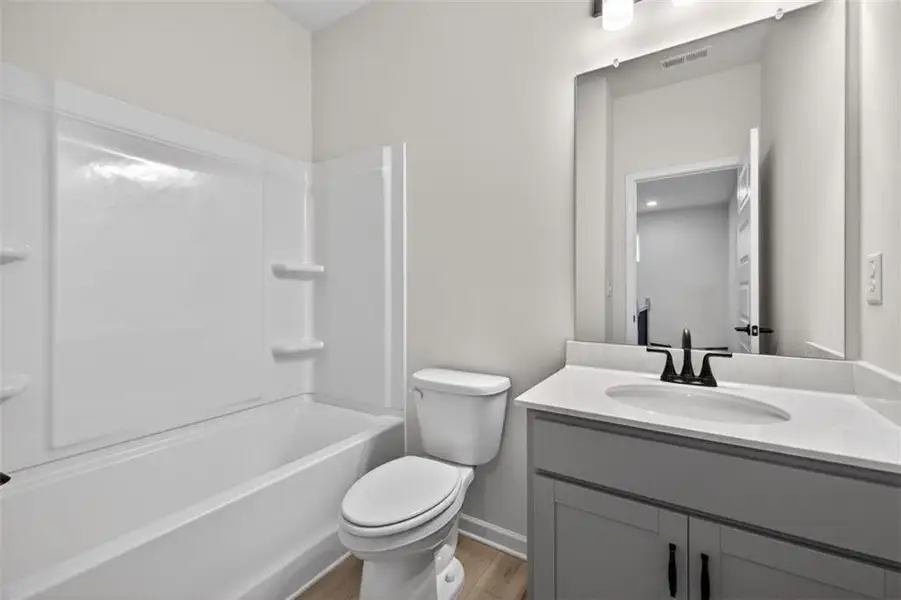 Furnished interior view inside a new home in Sanders Park, Austell (Image 8).