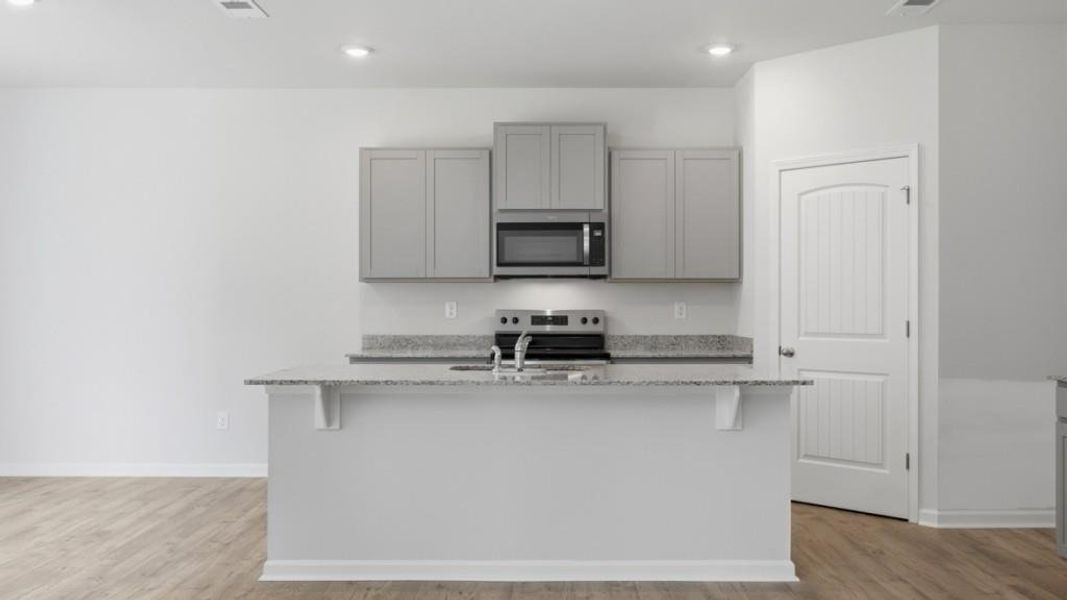 Furnished interior view inside a new home in Oaks at Cedar Grove, Fairburn (Image 5).