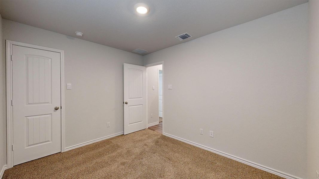 Unfurnished bedroom featuring baseboards and carpet floors Unfurnished bedroom featuring baseboards and carpet floors
