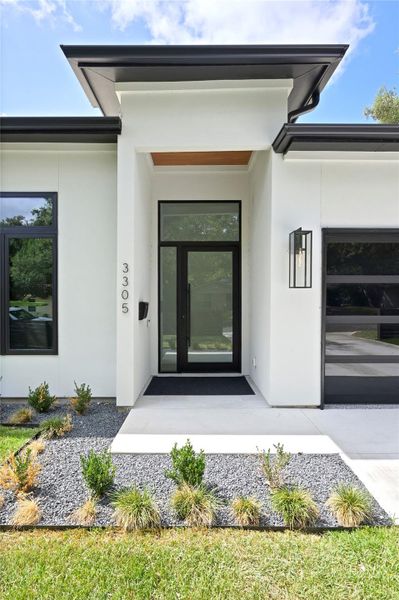 Property entrance with stucco siding