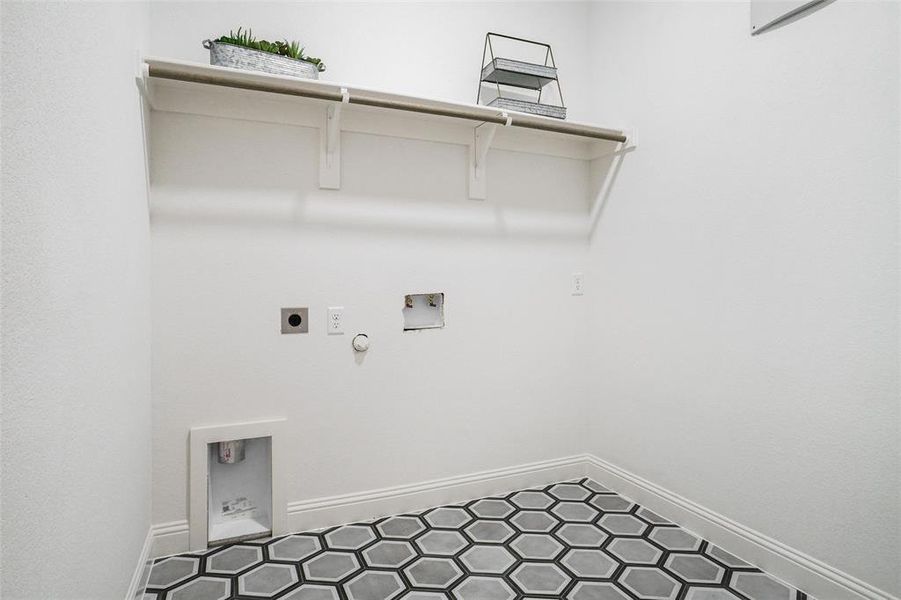 Clothes washing area featuring hookup for a washing machine, hookup for a gas dryer, and electric dryer hookup