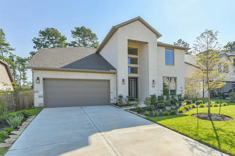 Front exterior of a new home in The Woodlands Hills – 55', Willis, TX, highlighting curb appeal (Image 2).