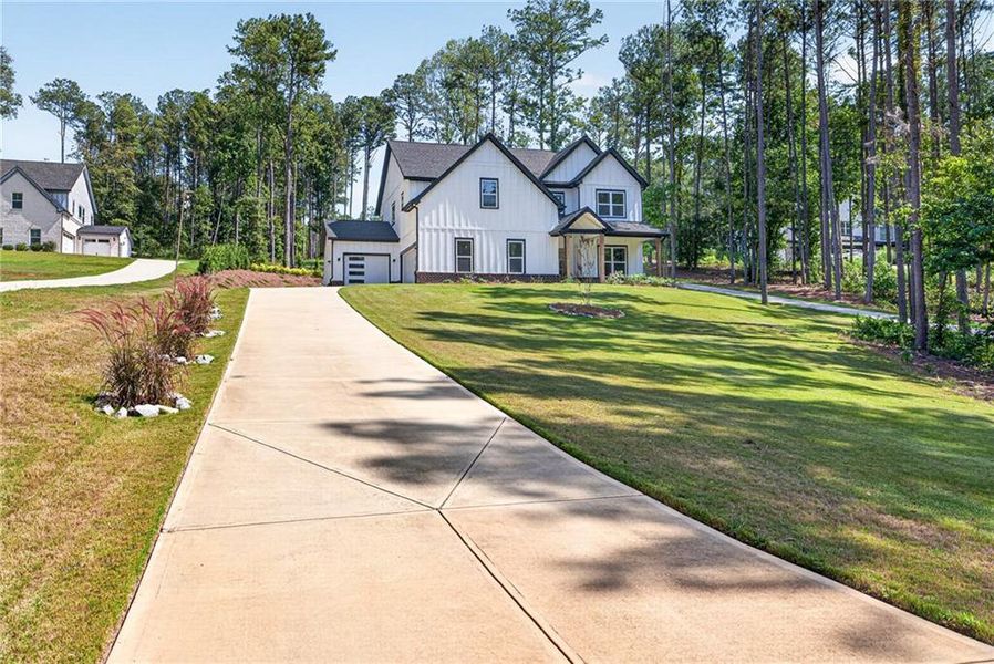 Front exterior of a new home in , Winder, GA, highlighting curb appeal (Image 28).