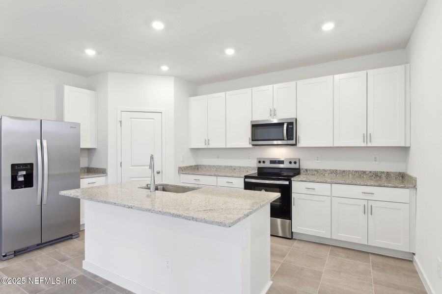 Furnished interior view inside a new home in Lakes at Bella Lago - Signature Series, Green Cove Springs (Image 10). Furnished interior view inside a new home in Lakes at Bella Lago - Signature Series, Green Cove Springs (Image 10).